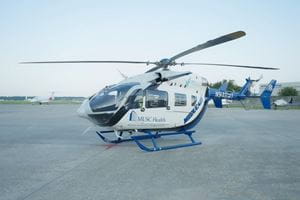 MUSC's Meducare helicopter transport on the ground at an airport.