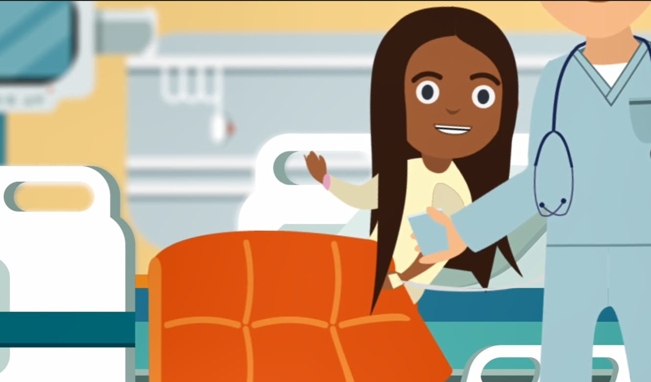 Image still from colonoscopy video featuring smiling child on hospital bed.