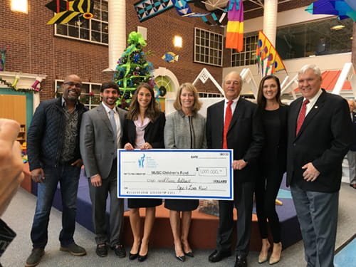 group photo with giant check