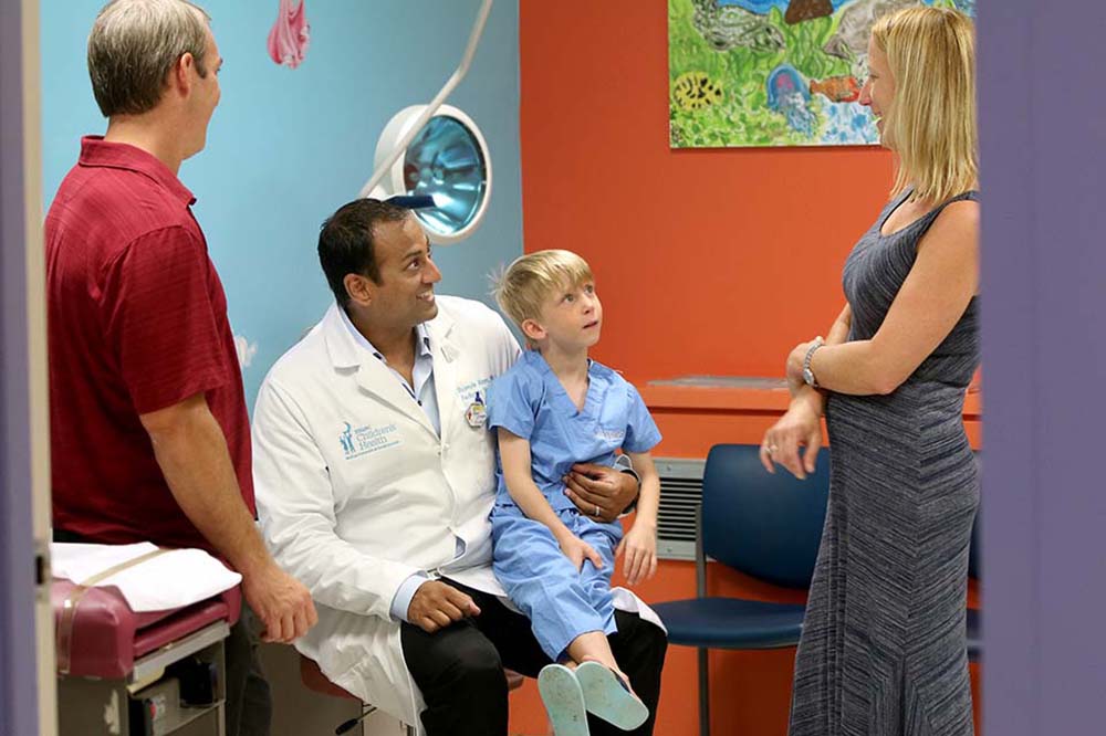 Shumyle Alam, M.D., meets with the Tanners
