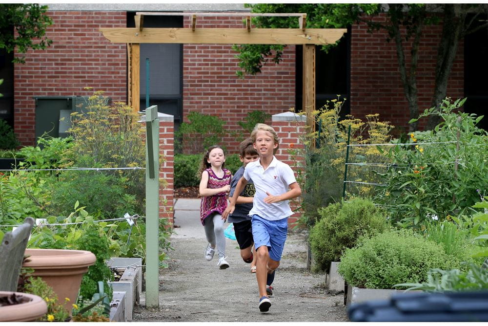 Children at school running down a garden path, courtesy of Boeing Center for Children's Wellness