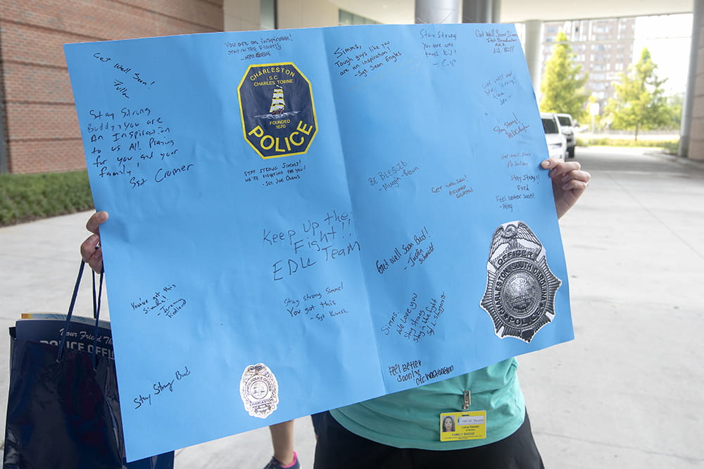 Large blue card signed by police officers for Simms Daniels