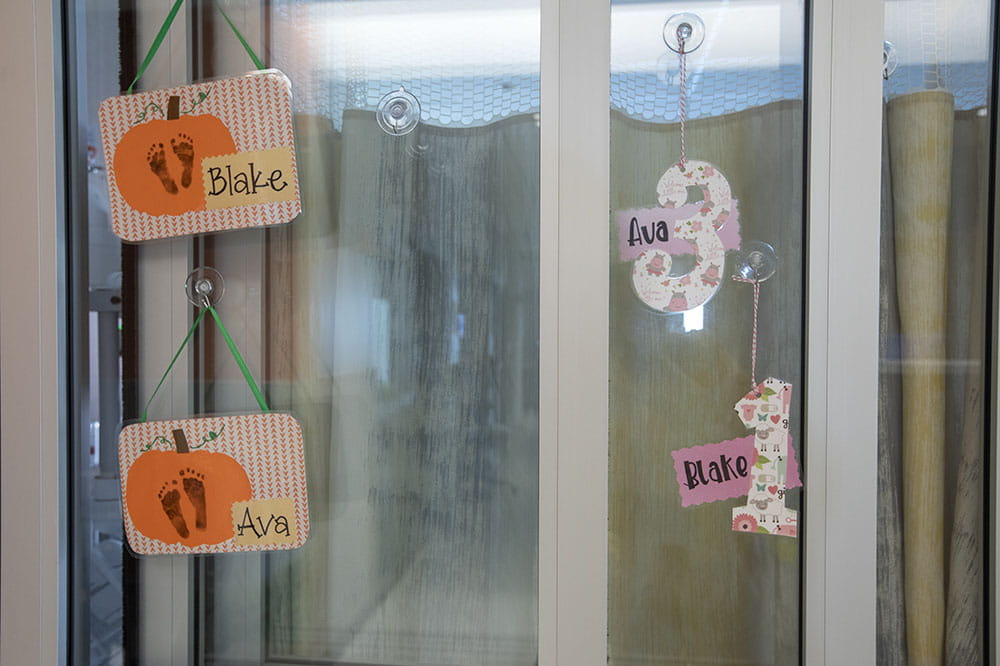 Name tags on a window with Ava, Blake, Colby and Colt.