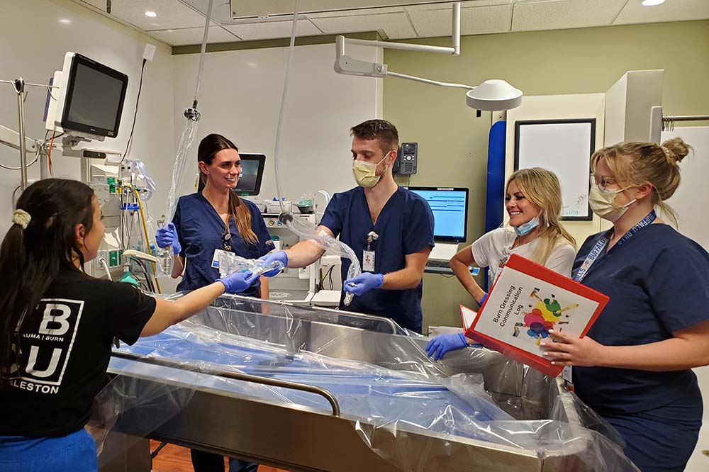 Members of the burn team prepping the hydrotherapy room. Left to right: Jordan Kudiak RN, Laura Sweet, RN, Matthew Jalbert PCT, Brianna Komcek, RN, Amanda Geiter PA-C.