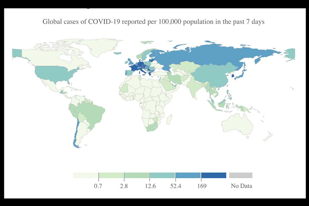 Map of the world showing different shades of blue and green to demonstrate where COVID is prevalent.