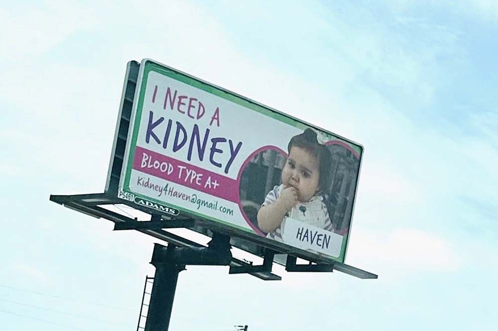 Advertisement for little girl to get a kidney on a billboard saying "I need a kidney"